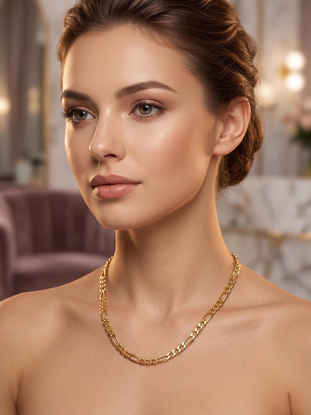 Elegant 14K gold Figaro chain necklace draped on a woman’s neck, showcasing a timeless Italian link design