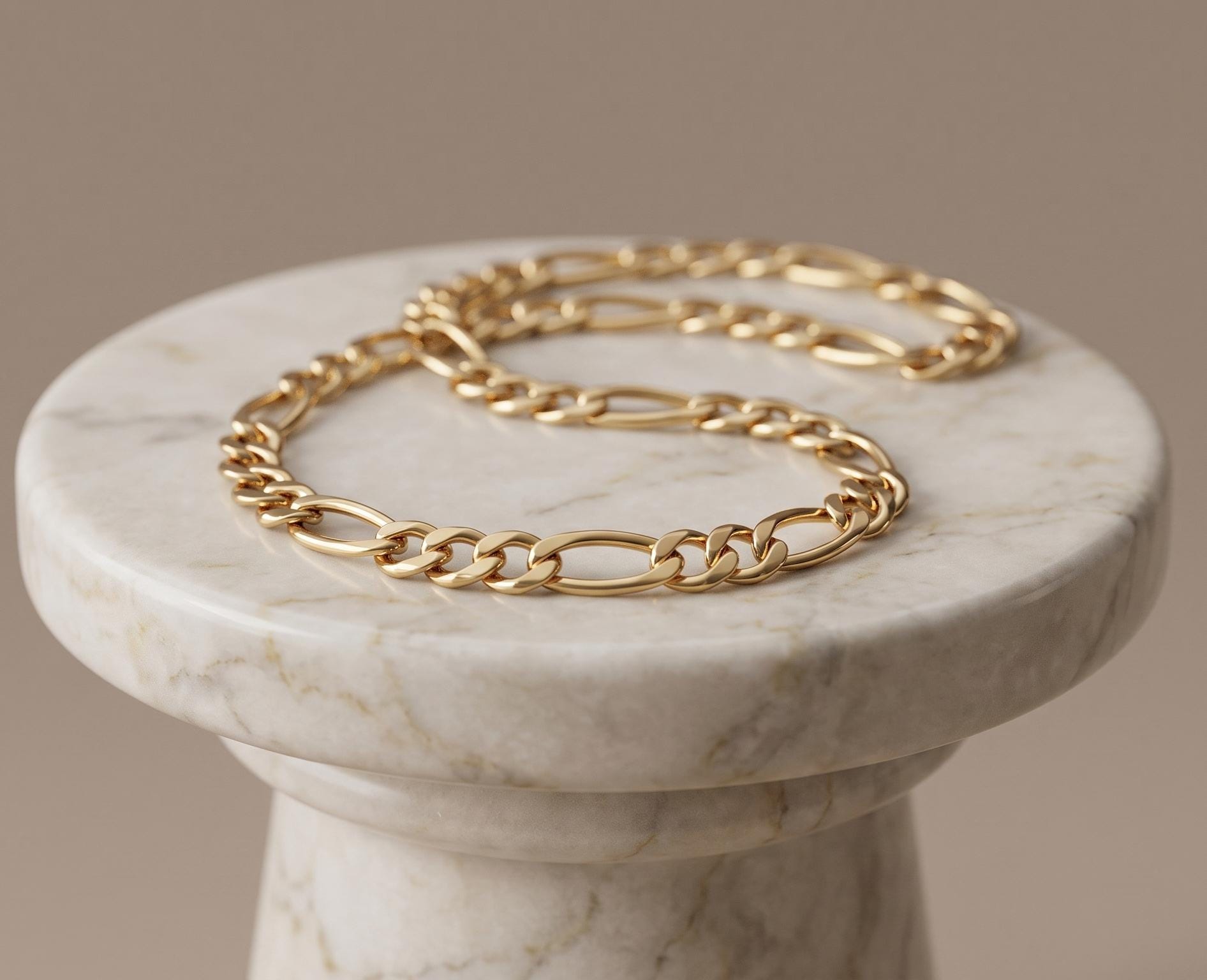 Close-up of a 14K gold Figaro chain necklace worn on a woman’s neck, featuring polished alternating links in a classic elegant design.